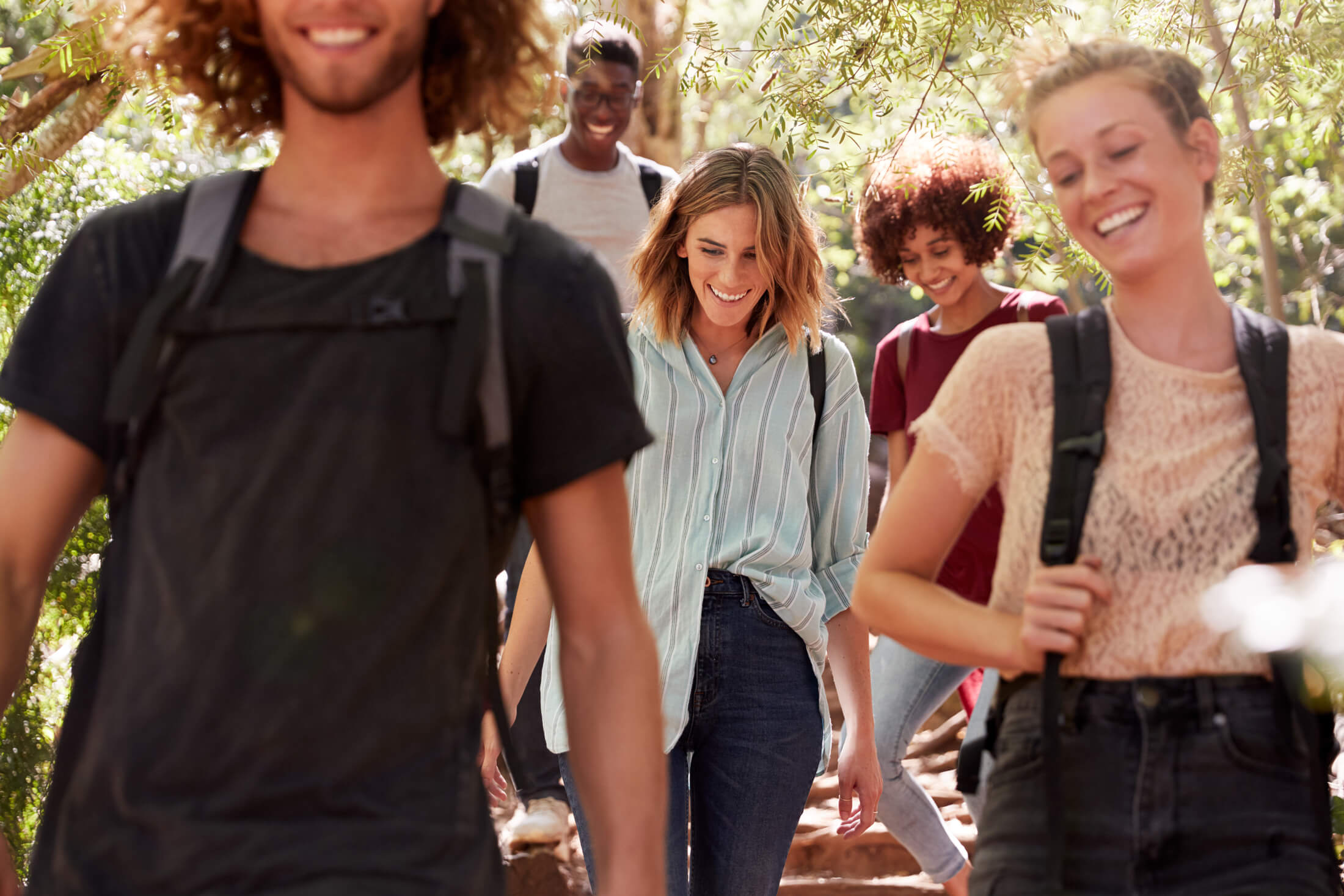 group of people with backpacks walking