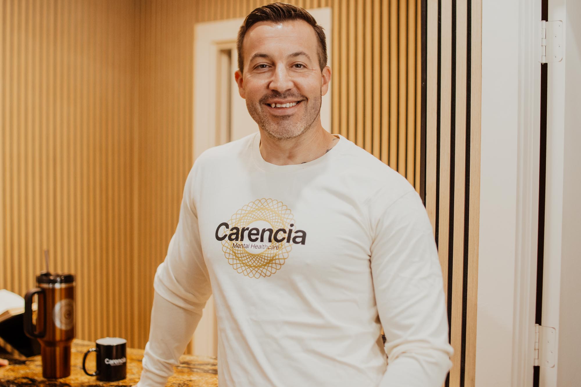 jesse tucker owner of carencia wearing a carencia shirt