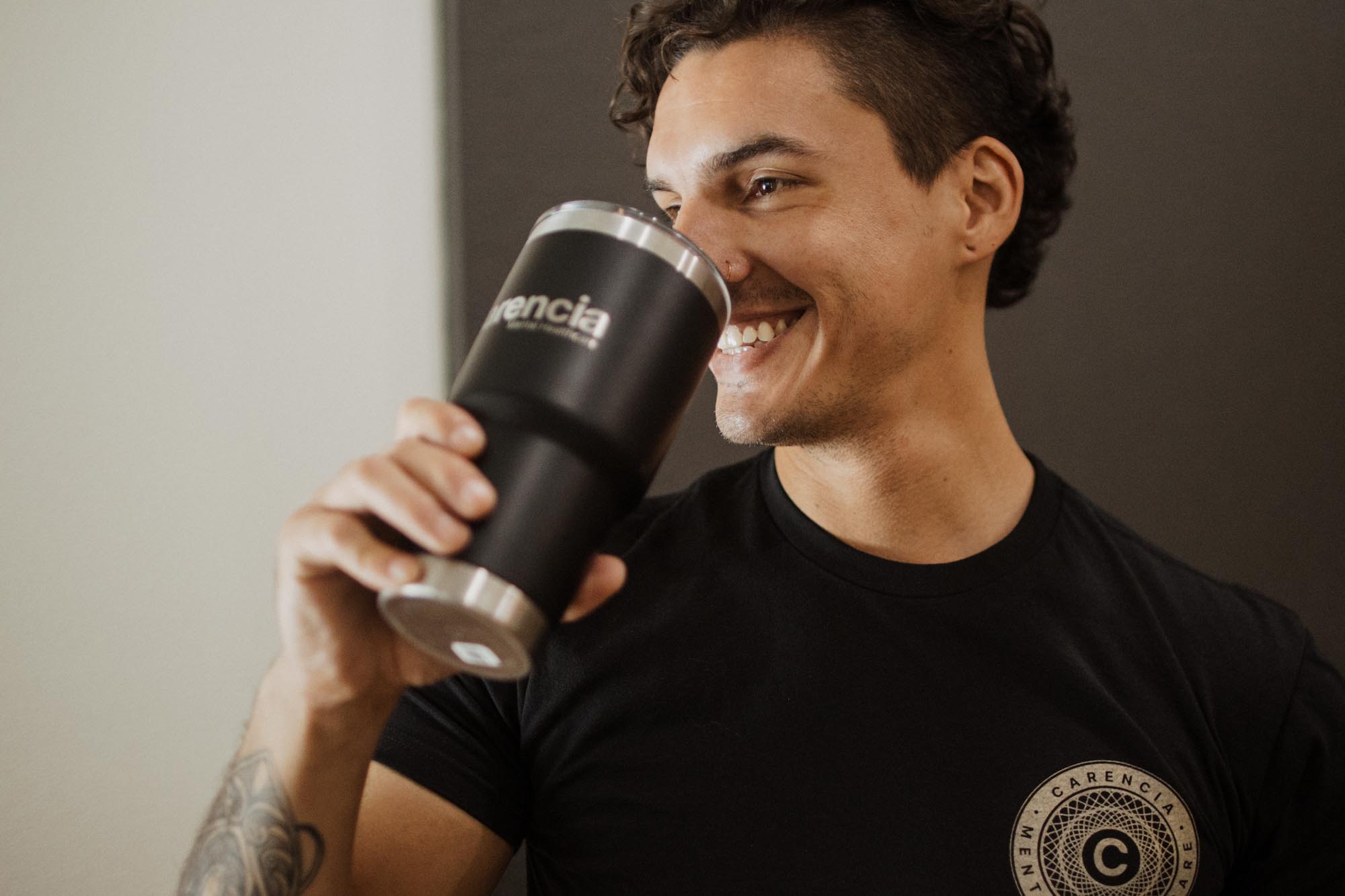 patient happily drinking from a carencia branded yeti