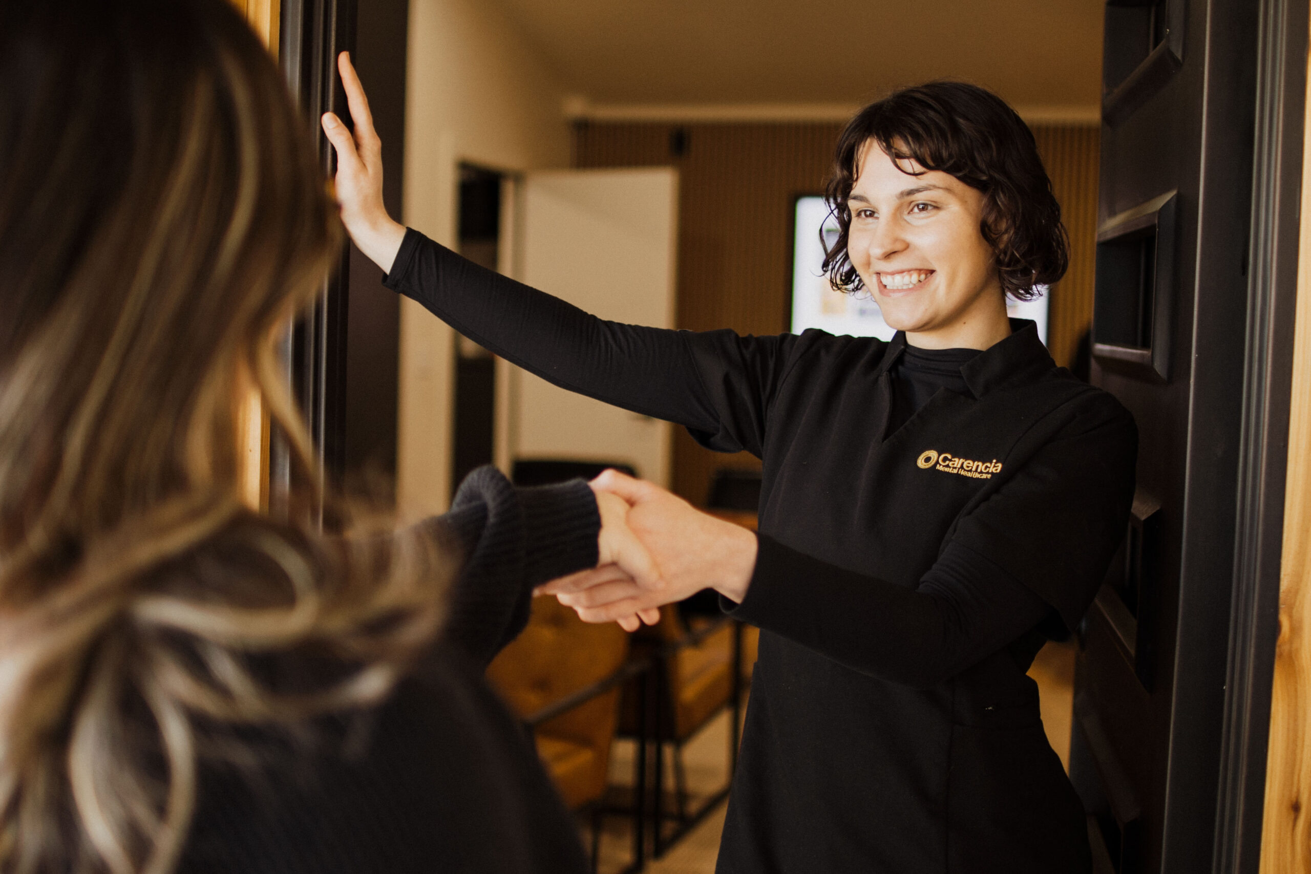 employee greeting a client