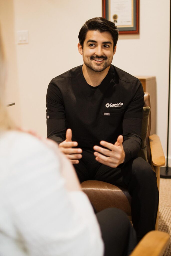 therapist gives therapy with a smile